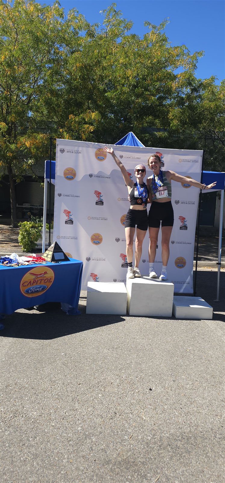 Finishers celebrating at the awards podium