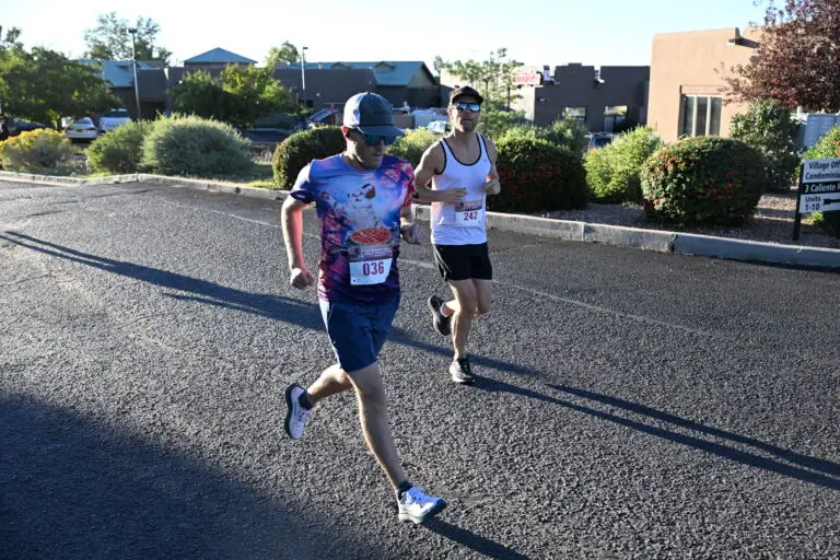 Two runners work the course together