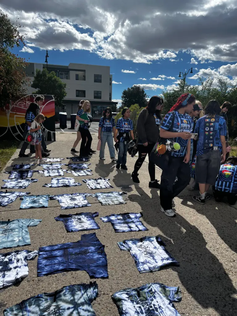 Tie-dye race shirts drying in the Railyard sun