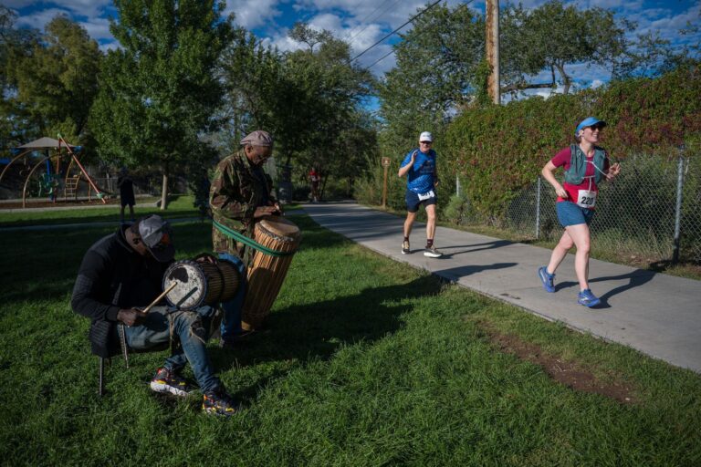 Drummers keep the beat for runners along the course on race morning