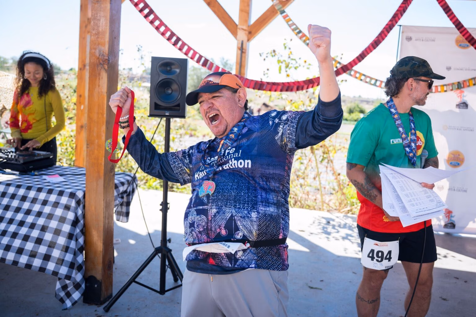 Volunteers and finishers celebrating at the finish area