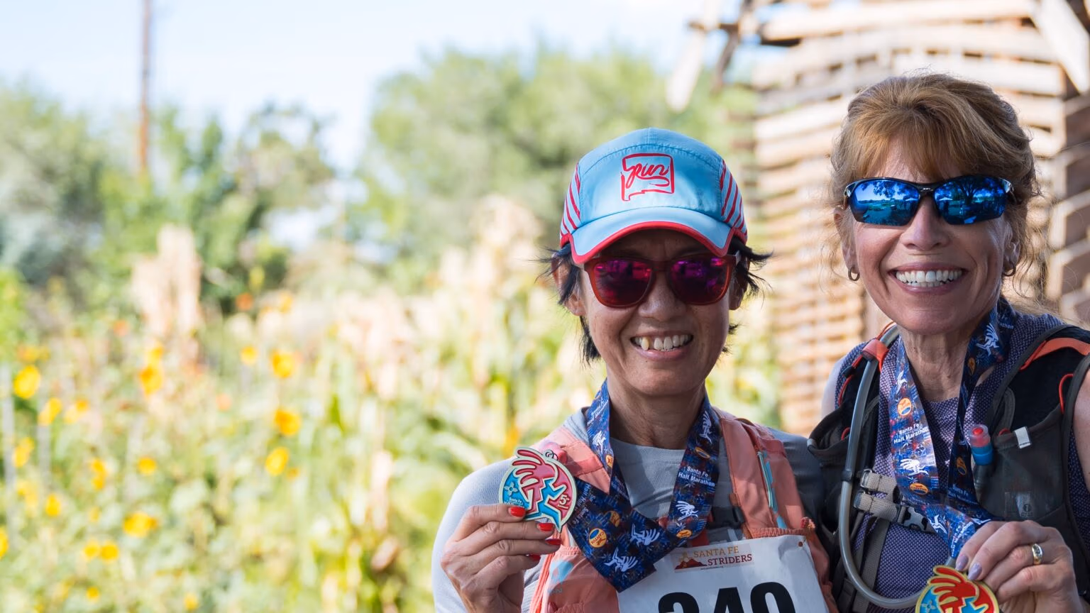 Smiling finishers with their medals